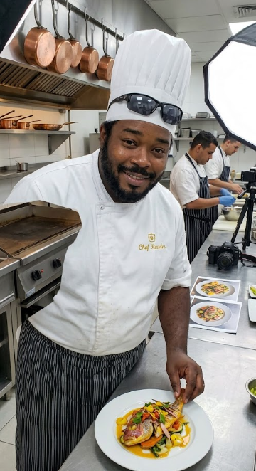 Chef Germaine Rawles plating in kitchen